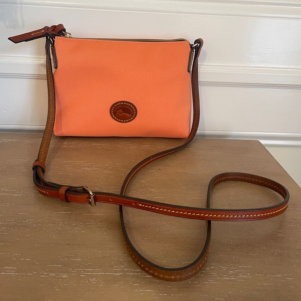 New Never used Dooney & Bourke Crossbody Pouchette light orange